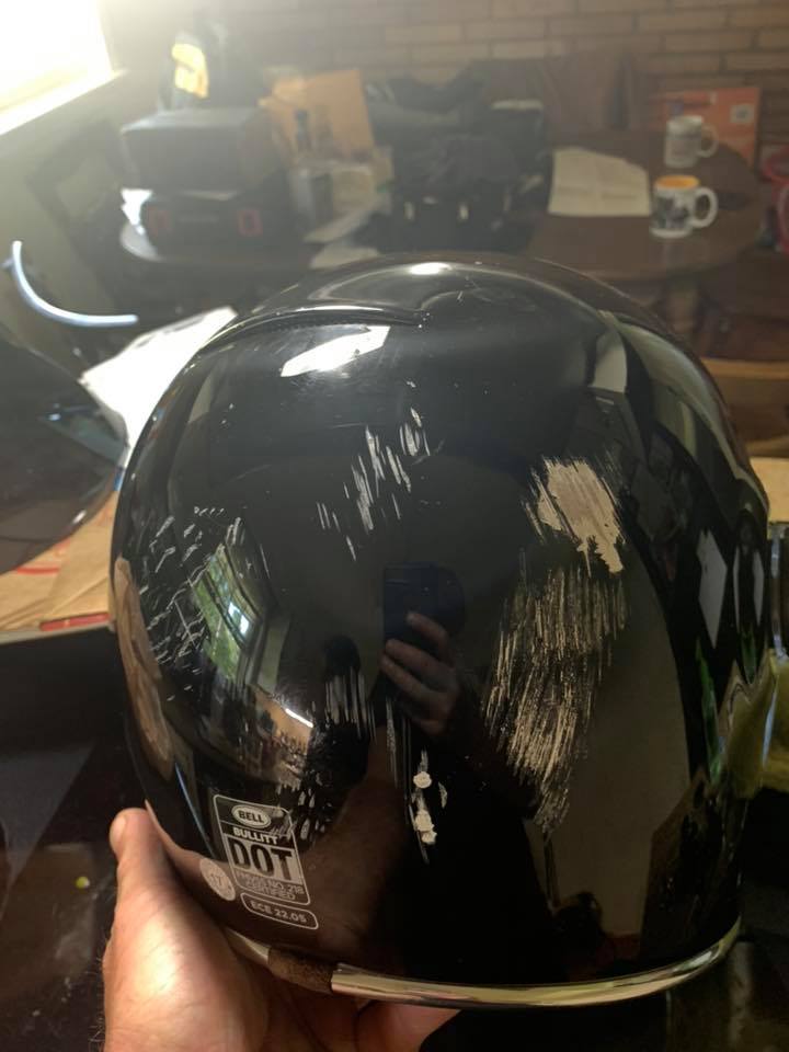 Picture of a motorcycle helmet after a collision with a deer.