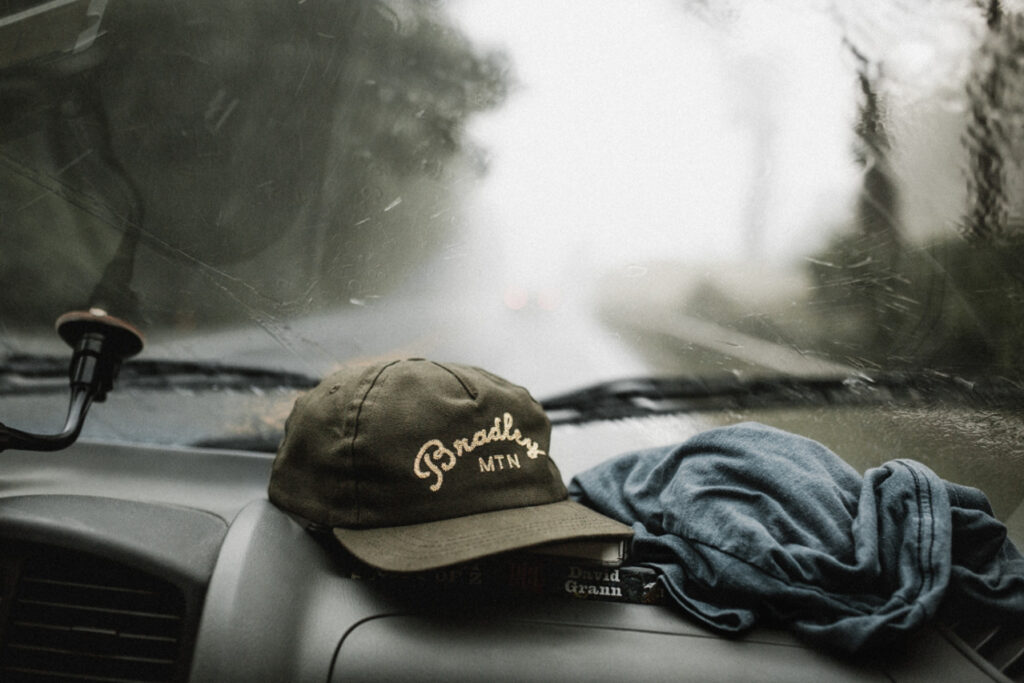 Rain on the windshield looking out where it is blurry and wet