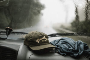 Rain on the windshield looking out where it is blurry and wet