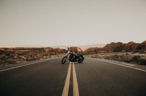 Motorcycle parked on the yellow lines on the highway